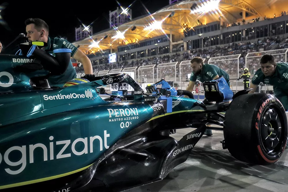 Fernando Alonso, Aston Martin AMR23, is returned to the garage