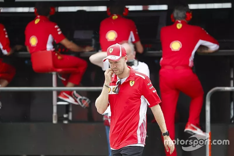 After crashing out, Sebastian Vettel, Ferrari, talks to Maurizio Arrivabene, Team Principal, Ferrari, and Jock Clear, Engineering Director, Ferrari