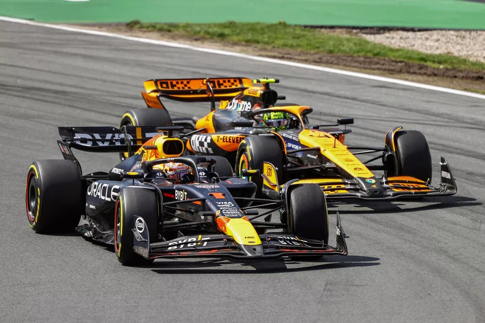 Max Verstappen, Red Bull Racing RB20, battles with Lando Norris, McLaren MCL38