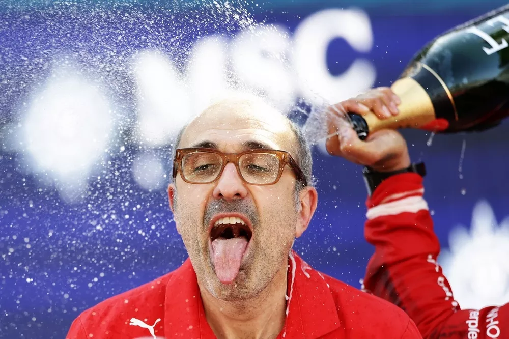 Carlos Santi, Race Engineer, Ferrari, celebrates on the podium.