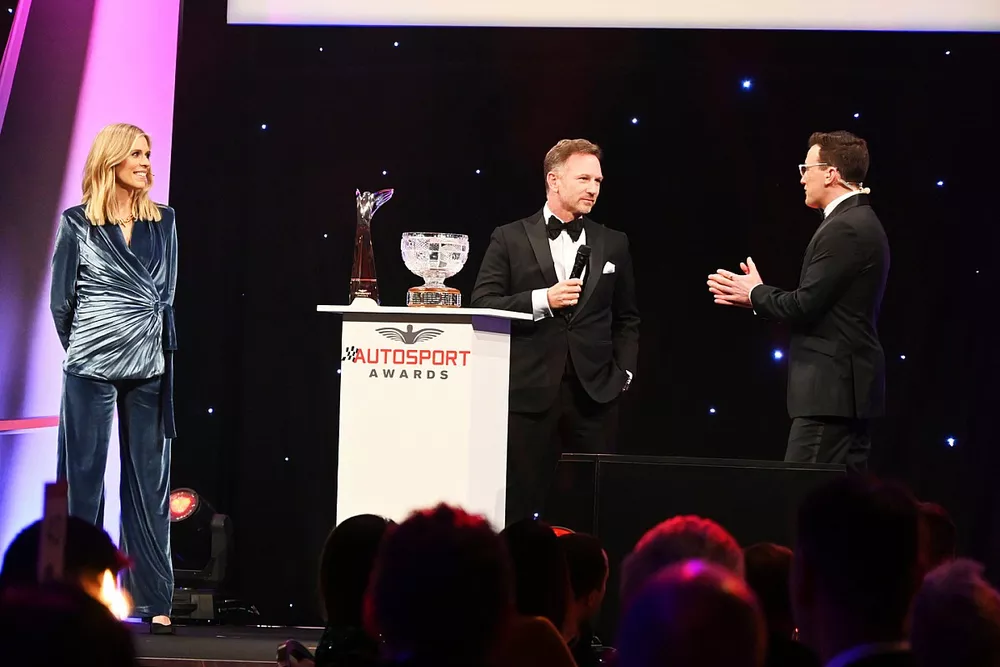 Presenters Nicky Shields and Will Buxton on stage with Christian Horner