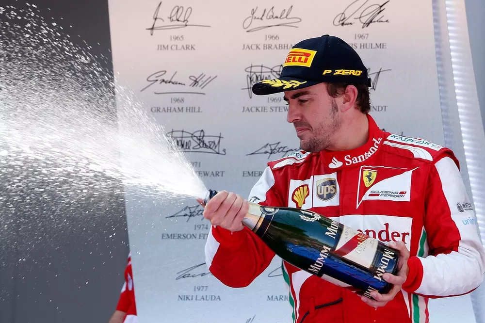 Podium: Fernando Alonso, Ferrari, sprays the Champagne