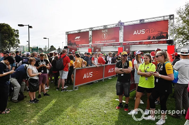 Fans queue at the delayed opening gates