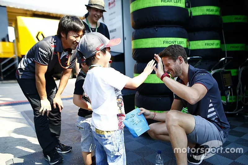 Romain Grosjean, Haas F1 Team, meets the guests with engineer Ayao Komatsu