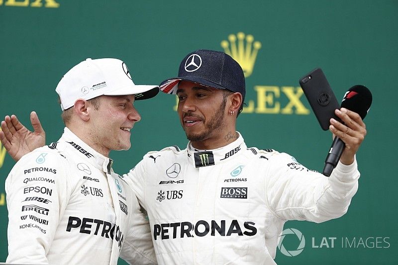 Podium:  Race winner Lewis Hamilton, Mercedes AMG F1, takes a photo of Second place Valtteri Bottas,