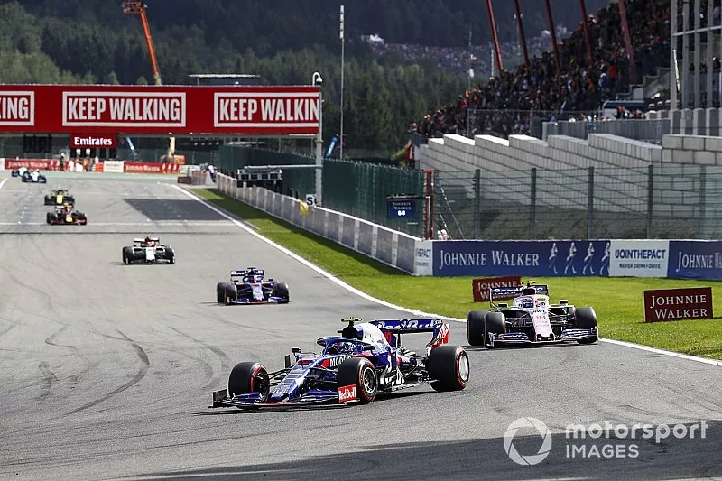 Pierre Gasly, Toro Rosso STR14, leads Lance Stroll, Racing Point RP19 and Daniil Kvyat, Toro Rosso STR14 