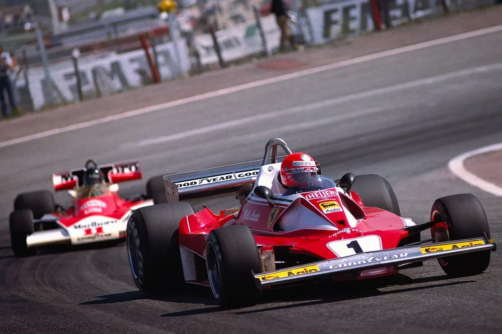 Niki Lauda, Ferrari 312T2, leads James Hunt, McLaren M23 Ford
