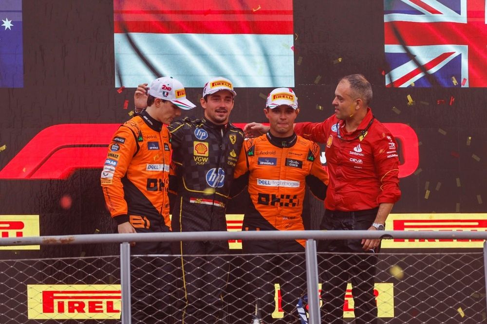 Oscar Piastri, McLaren F1 Team, 2nd position, Charles Leclerc, Scuderia Ferrari, 1st position, Lando Norris, McLaren F1 Team, 3rd position, the Ferrari trophy delegate on the podium