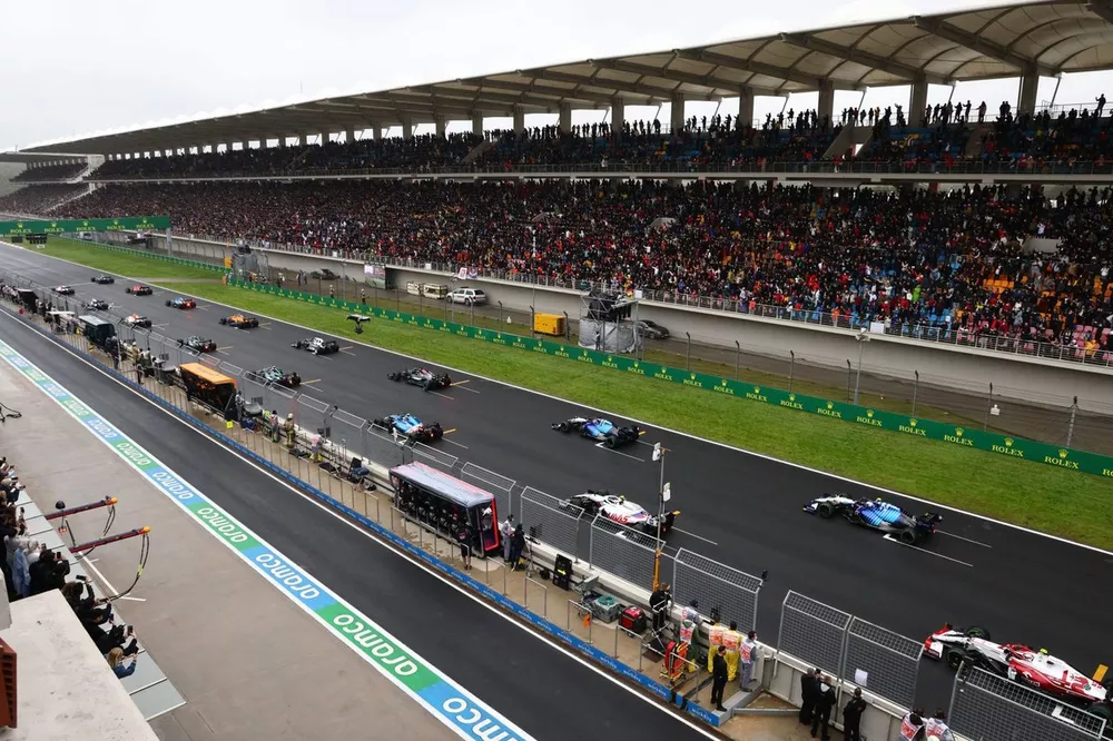 The drivers pull away for the start of the race