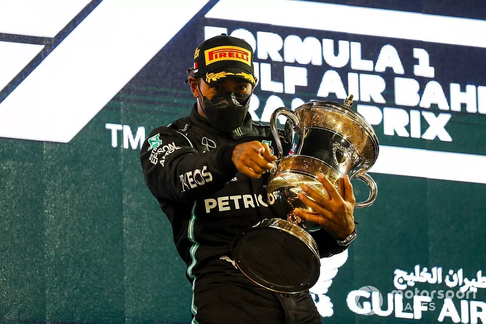 Lewis Hamilton, Mercedes, 1st position, on the podium with his trophy