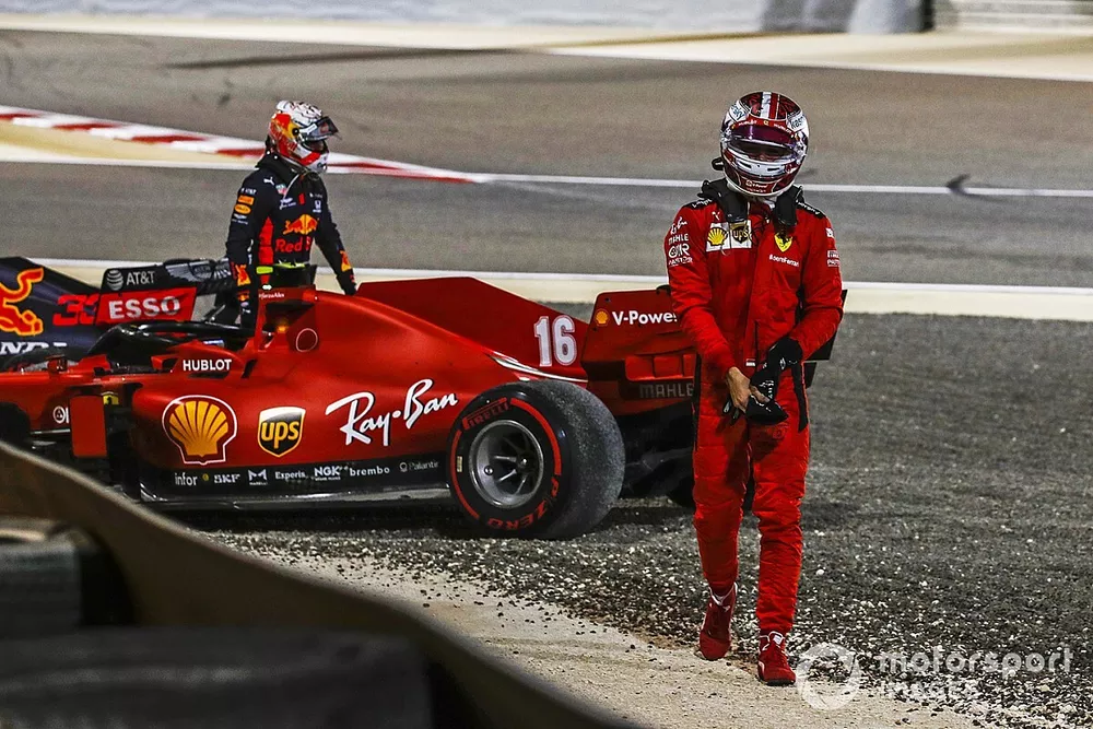 Max Verstappen, Red Bull Racing, and Charles Leclerc, Ferrari, walk away after retiring