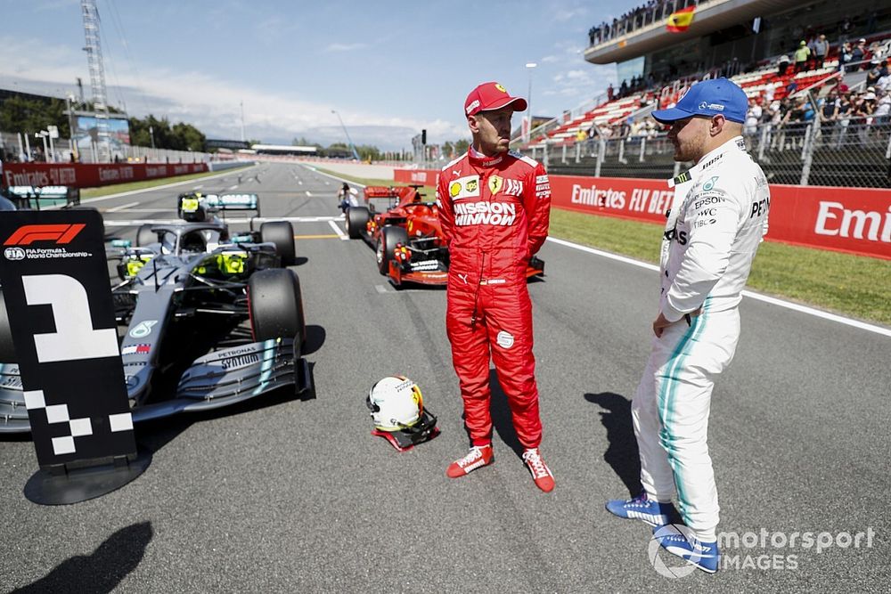 Sebastian Vettel, Ferrari and Pole Sitter Valtteri Bottas, Mercedes AMG F1 talk in Parc Ferme 