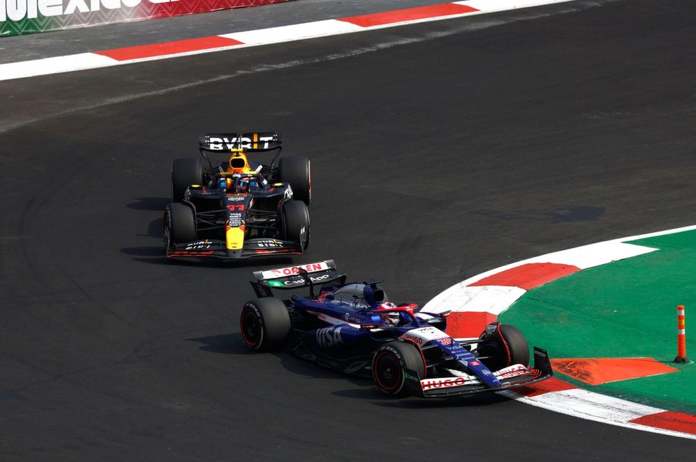 Liam Lawson, VCARB 01, leads Sergio Perez, Red Bull Racing RB20