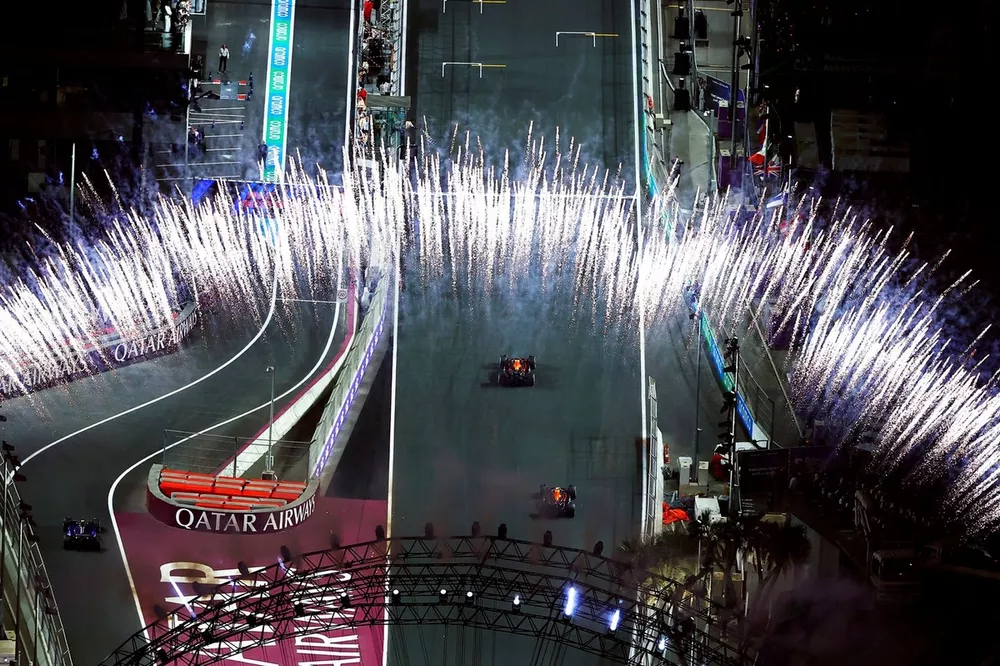 Max Verstappen, Red Bull Racing RB20, 1st position, Sergio Perez, Red Bull Racing RB20, 2nd position, drive up the grid after the finish