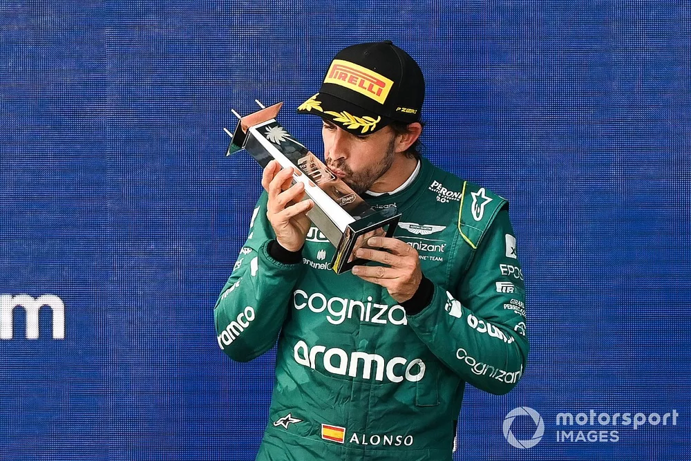 Fernando Alonso, Aston Martin F1 Team, 3rd position, kisses his trophy on the podium