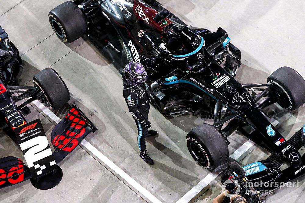 Race Winner looking at his car in Parc Ferme 
