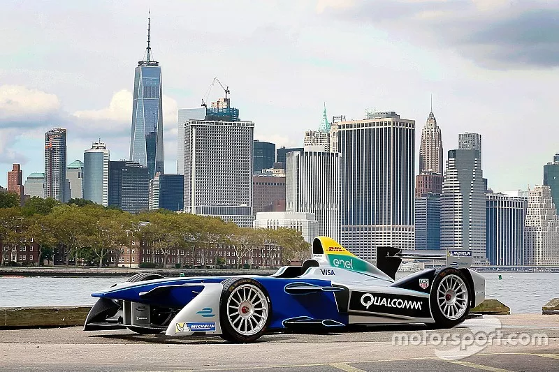 A Formula E car with the New York City skyline