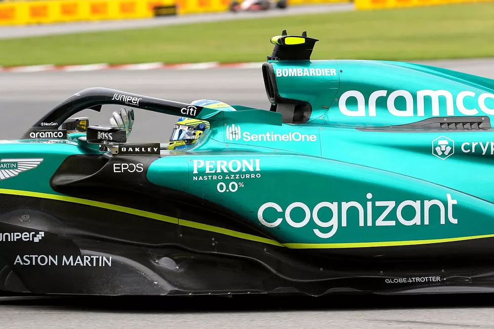 Fernando Alonso, Aston Martin AMR23, 2nd position, waves to fans at the end of the race