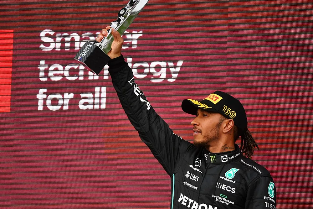 Lewis Hamilton, Mercedes, 3rd position, raises his trophy
