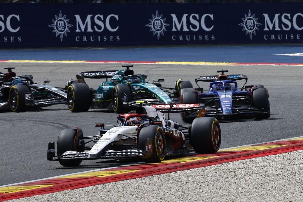 Yuki Tsunoda, AlphaTauri AT04, leads Alex Albon, Williams FW45, and Lance Stroll, Aston Martin AMR23