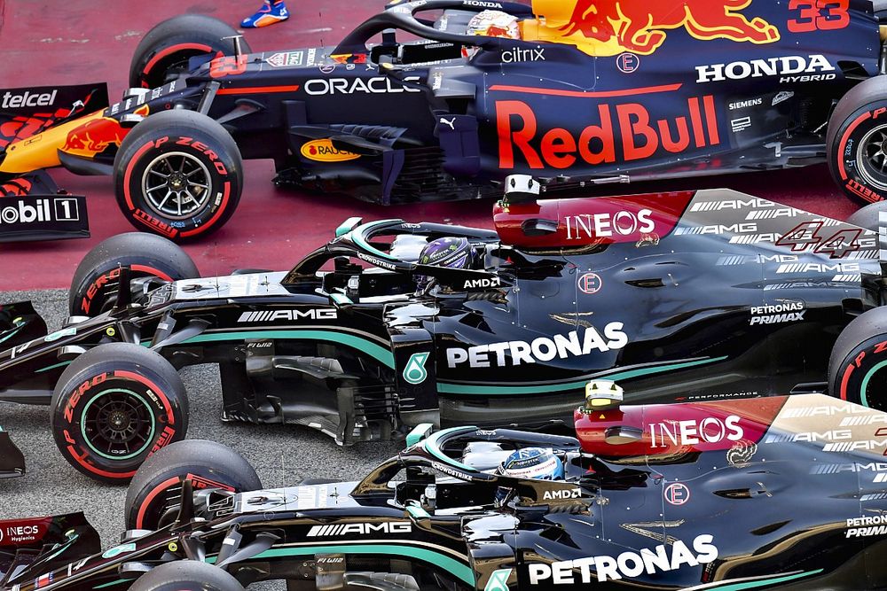 Pole man Lewis Hamilton, Mercedes W12, Max Verstappen, Red Bull Racing RB16B, and Valtteri Bottas, Mercedes W12, arrive in Parc Ferme after Qualifying