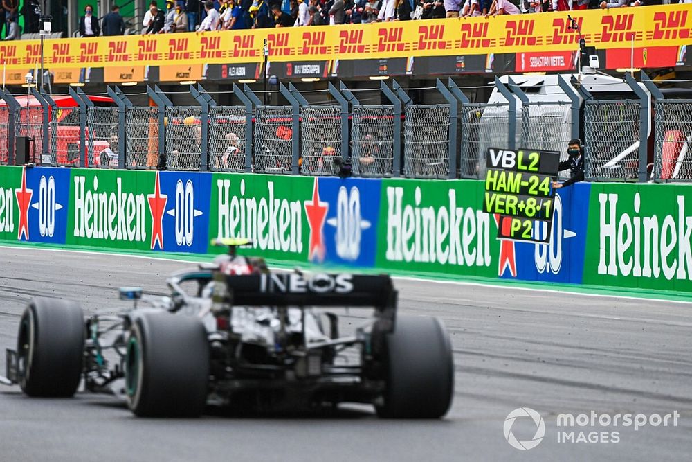 Valtteri Bottas, Mercedes F1 W11, passes his pit board
