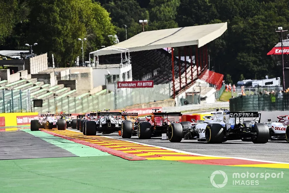 Sebastian Vettel, Ferrari SF1000, and Nicholas Latifi, Williams FW43, chase the pack at the start