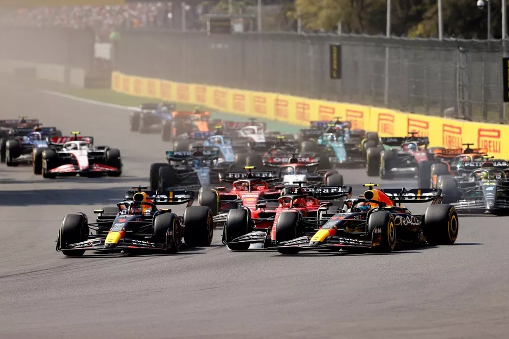 Max Verstappen, Red Bull Racing RB19 battles with Charles Leclerc, Ferrari SF-23, Sergio Perez, Red Bull Racing RB19, at the start of the race