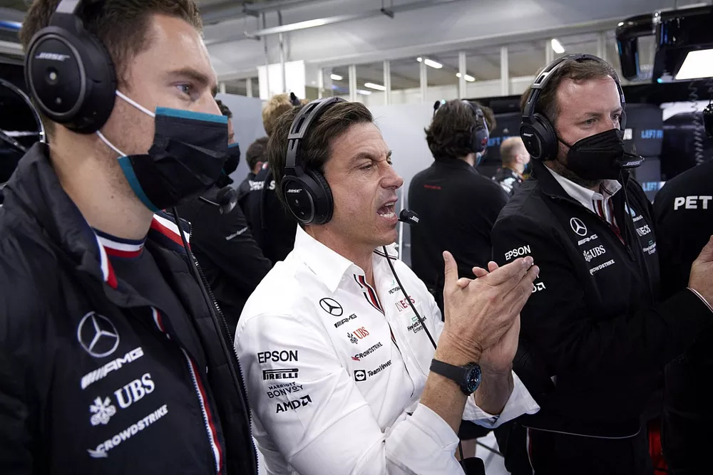 Stoffel Vandoorne, Mercedes-AMG F1 reserve driver, and Toto Wolff, Team Principal and CEO, Mercedes AMG, in the garage