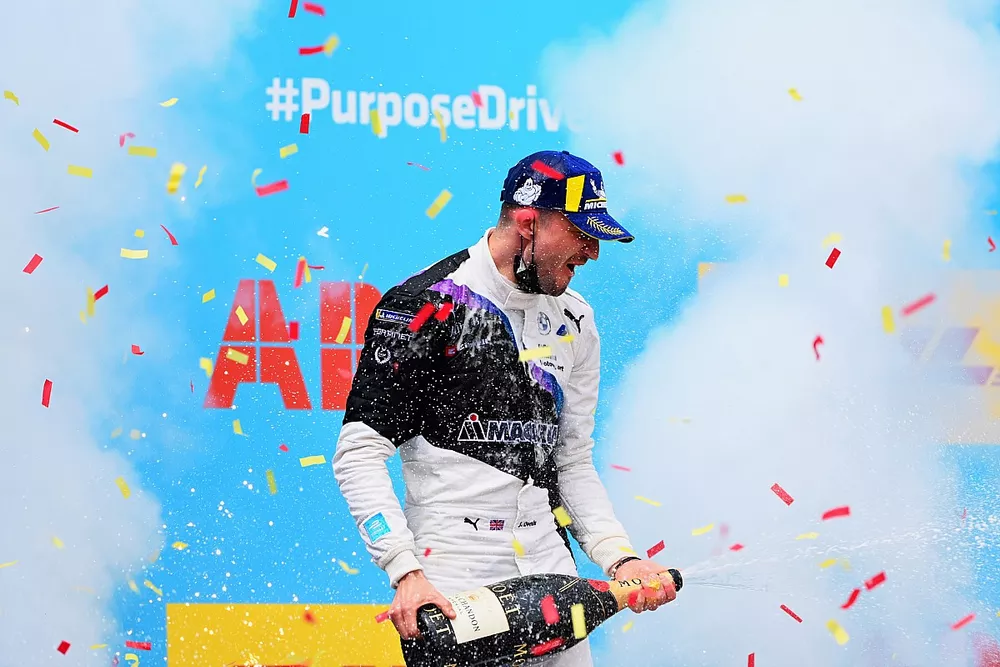 Jake Dennis, BMW i Andretti Motorsport, 1st position, sprays the victory Champagne