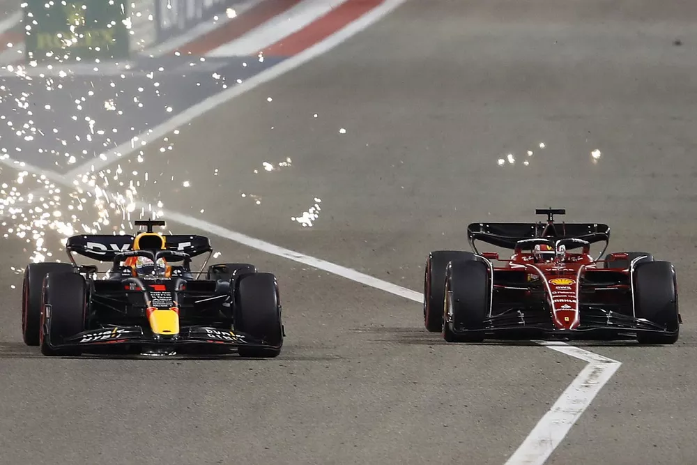 Sparks fly as Max Verstappen, Red Bull Racing RB18, battles with Charles Leclerc, Ferrari F1-75