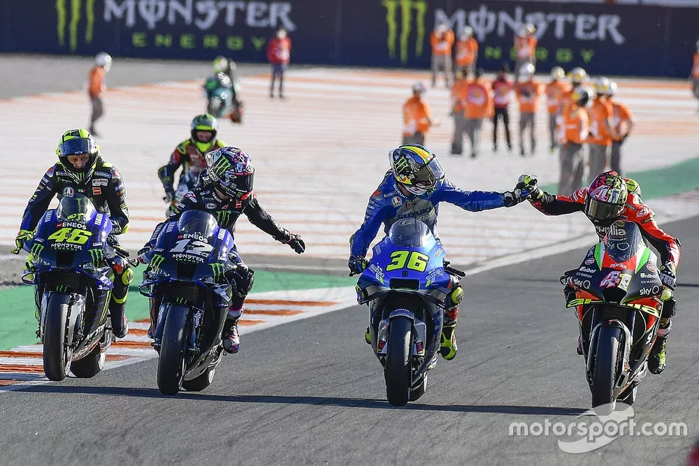 Joan Mir, Team Suzuki MotoGP being congratulated by Aleix Espargaro, Aprilia Racing Team Gresini, Maverick Vinales, Yamaha Factory Racing, Valentino Rossi, Yamaha Factory Racing