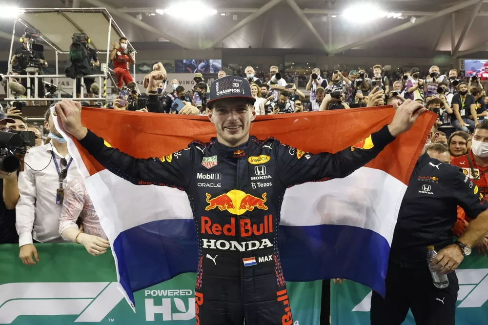 Max Verstappen, Red Bull Racing, 1st position, celebrates with a Dutch flag in Parc Ferme