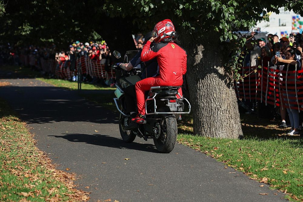 Charles Leclerc, Scuderia Ferrari, is given a lift back to the pits after retiring on the opening lap