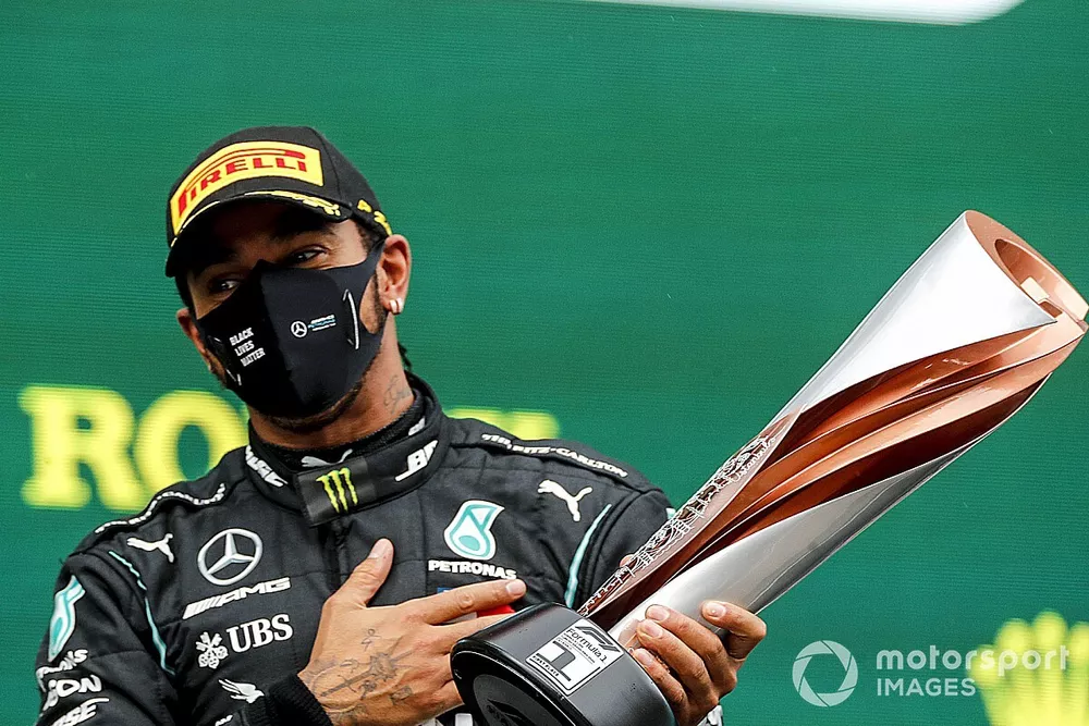 Lewis Hamilton, Mercedes-AMG F1, on the podium after winning the race, to take his 7th World Championship title