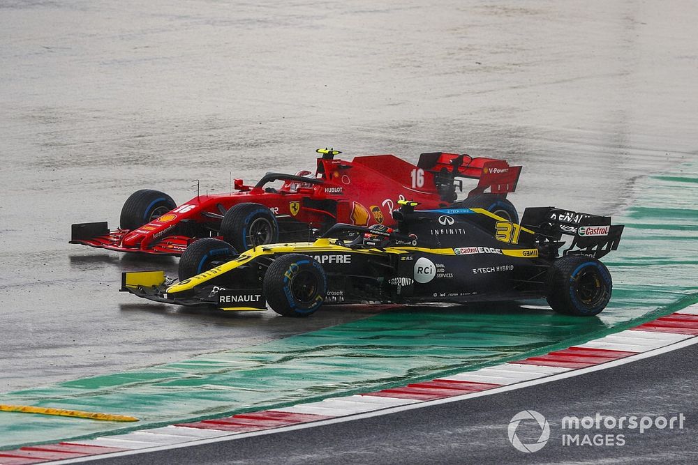 Esteban Ocon, Renault F1 Team R.S.20, and Charles Leclerc, Ferrari SF1000, leave the track at the start
