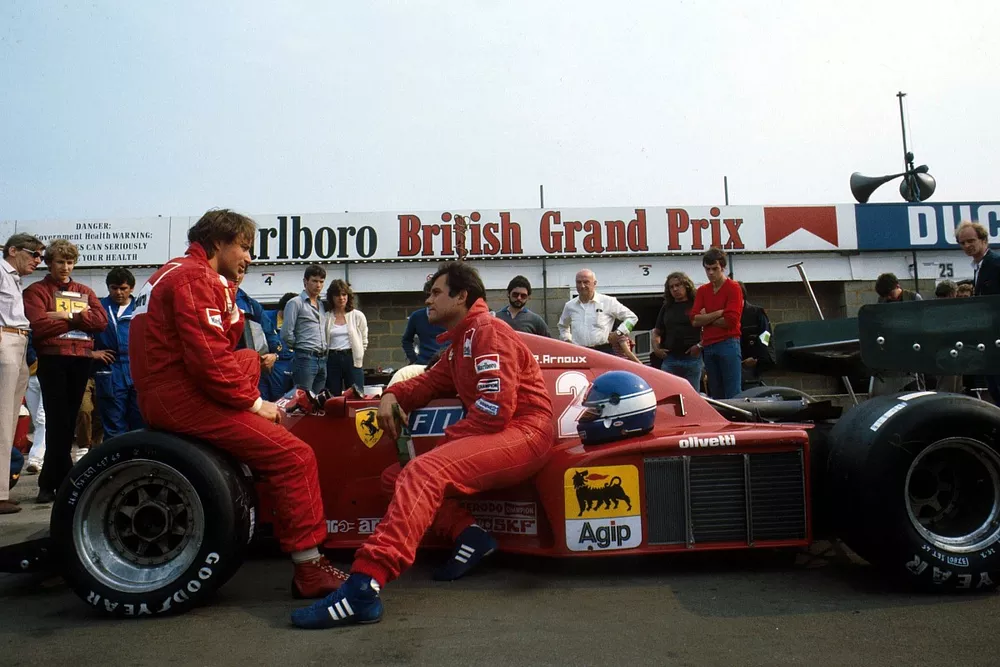 The Ferrari team mates Rene Arnoux, left and Patrick Tambay chat.
British GP, Silverstone, England,16 July 1983