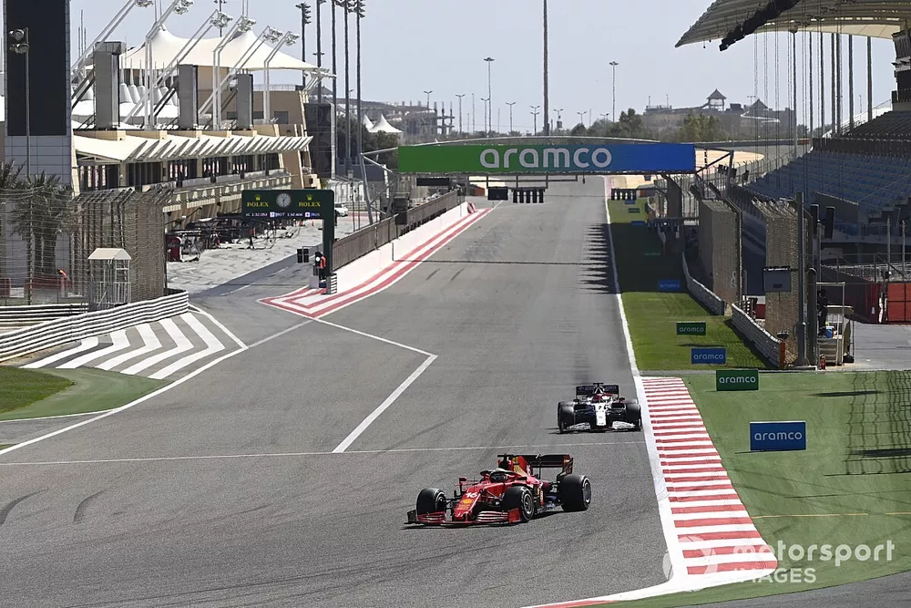 Charles Leclerc, Ferrari SF21 and Kimi Raikkonen, Alfa Romeo Racing C41 