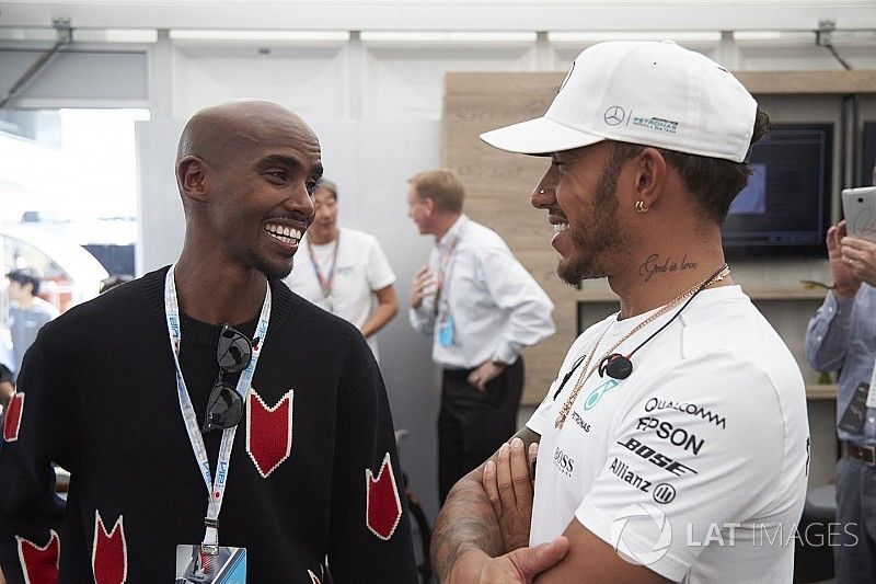 Olympic champion Sir Mo Farah talks to Lewis Hamilton, Mercedes AMG F1