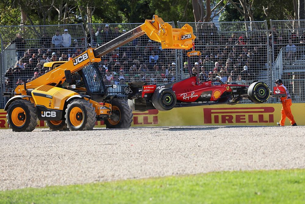 Marshals remove the car of Charles Leclerc, Ferrari SF-23, from the circuit