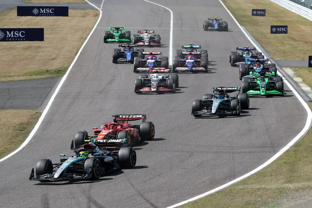 Lewis Hamilton, Mercedes F1 W15 battles with Charles Leclerc, Ferrari SF-24 at the race start