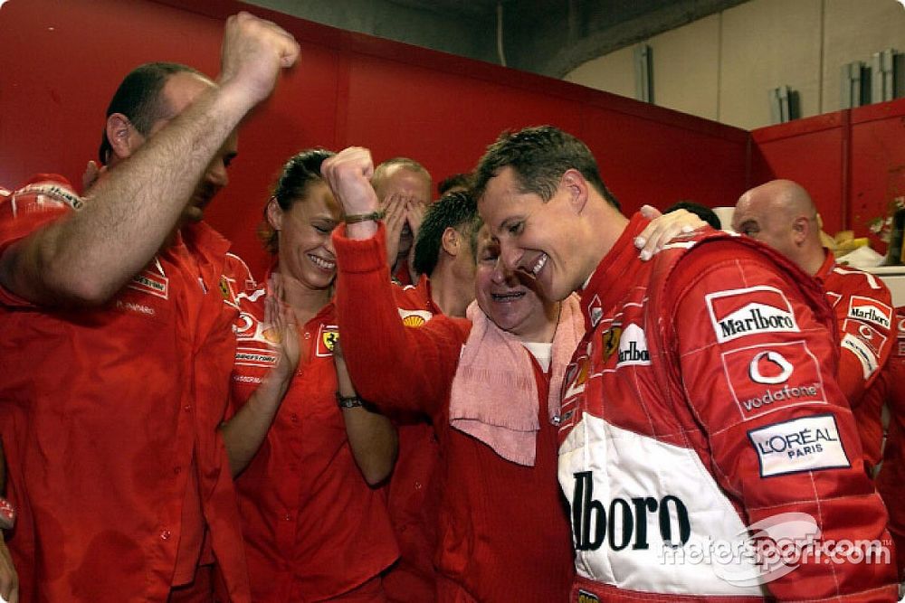 Michael Schumacher celebrates sixth world championship with Ferrari team members