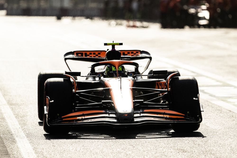 Lando Norris, McLaren MCL38, in the pit lane