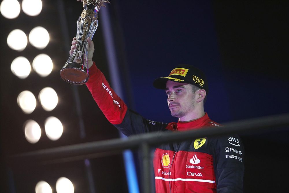 Charles Leclerc, Ferrari, 2nd position, lifts his trophy