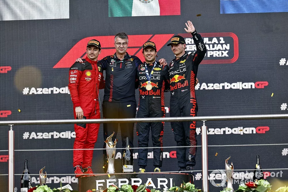 Charles Leclerc, Scuderia Ferrari, 3rd position, the Red Bull trophy delegate, Sergio Perez, Red Bull Racing, 1st position, Max Verstappen, Red Bull Racing, 2nd position, on the podium