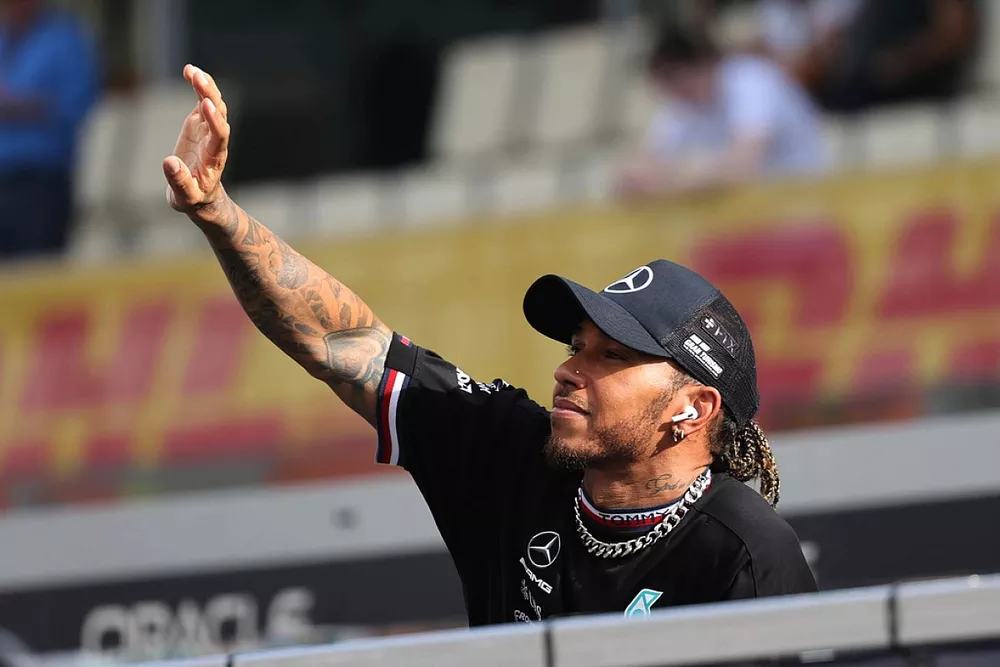 Lewis Hamilton, Mercedes AMG, waves on the drivers' parade