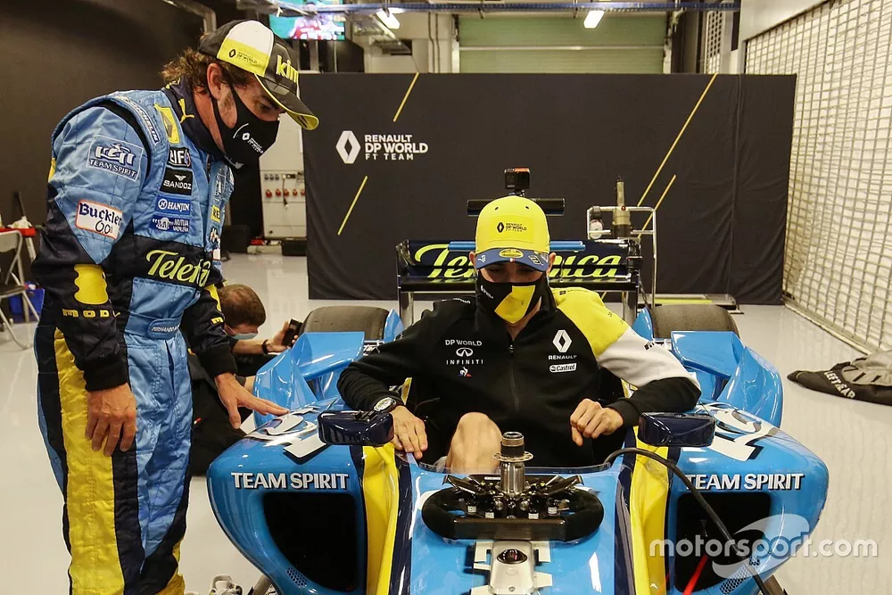 Fernando Alonso, Renault F1 Team with the 2005 Renault R25 and Esteban Ocon, Renault F1 Team