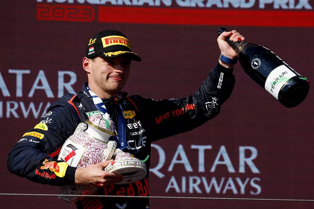 Max Verstappen, Red Bull Racing, 1st position, leaves the podium with the bits of his broken trophy