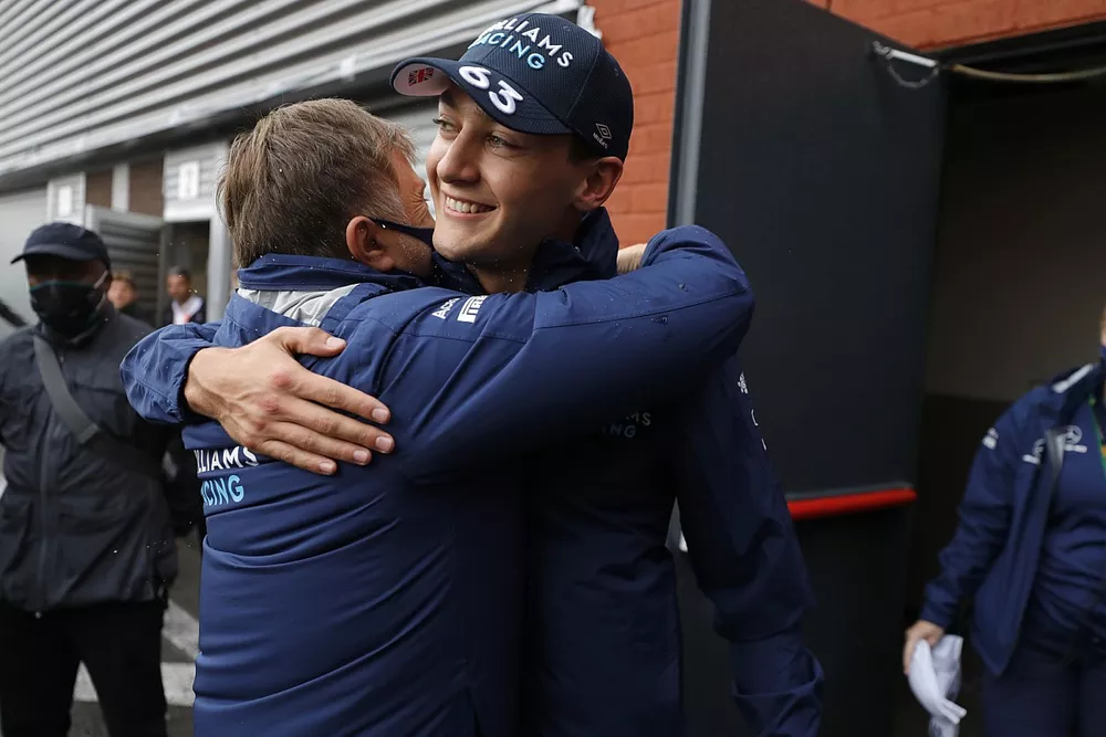 George Russell, Williams, celebrates with Jost Capito, CEO, Williams, after securing second position in Qualifying