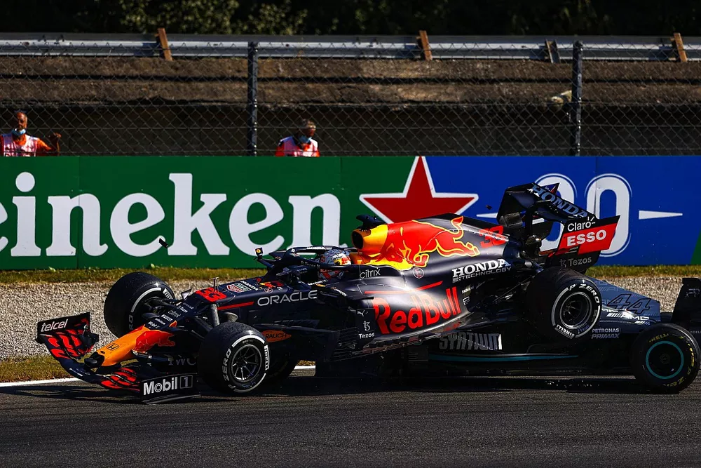 Max Verstappen, Red Bull Racing RB16B, and Lewis Hamilton, Mercedes W12, crash out